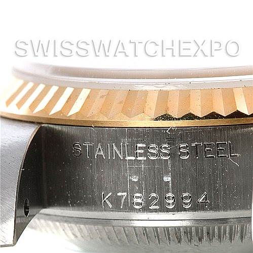 The image shows a close-up of the side of a Rolex Datejust 79173 Women's Stainless Steel Silver Dial 79173 Women's Stainless Steel Silver Dial watch, highlighting its stainless steel case and part of the fluted bezel.