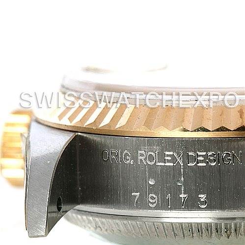 This image shows the side view of the Rolex Datejust 79173 Women's Stainless Steel Silver Dial 79173 Women's Stainless Steel Silver Dial watch case, highlighting the bezel, crown, and model number engraving.