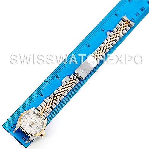 The Rolex Datejust 79173 Women's Stainless Steel Silver Dial 79173 Women's Stainless Steel Silver Dial watch is shown from a top-down angle, featuring its face and full bracelet laid next to a ruler for scale.