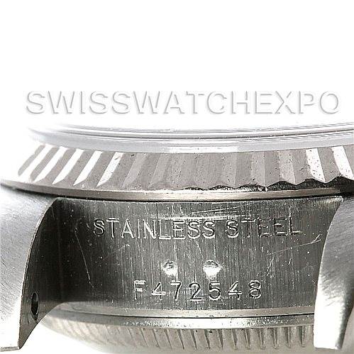 This image shows a close-up of the side of a Rolex Datejust 79174 Women's Stainless Steel White Dial 79174 Women's Stainless Steel White Dial watch, highlighting its stainless steel case and serial number.