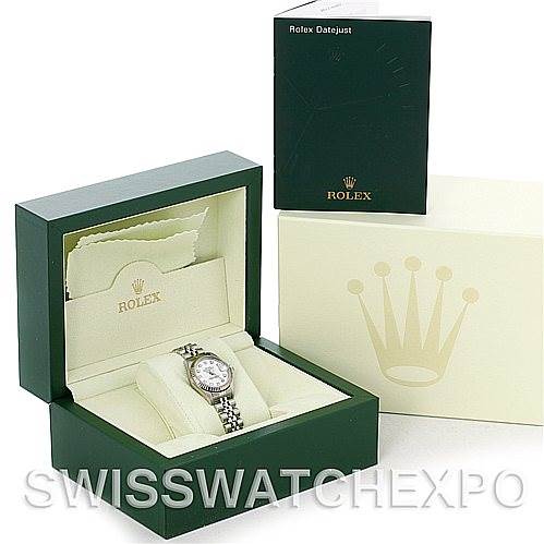 The image shows a Rolex Datejust 79174 Women's Stainless Steel White Dial 79174 Women's Stainless Steel White Dial watch in an open green display box with accompanying manual and outer packaging.