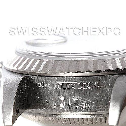 This image shows a close-up angle of the side of a Rolex Datejust 79174 Women's Stainless Steel White Dial 79174 Women's Stainless Steel White Dial watch, highlighting the case and engraved model number.