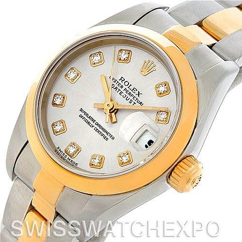 This image shows a Rolex Datejust 79163 Women's Steel and Gold (two tone) Silver Dial 79163 Women's Steel and Gold (two tone) Silver Dial watch from an angled view, highlighting the dial, bezel, and part of the bracelet.