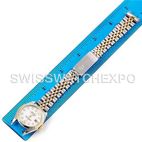 The image shows a Rolex Datejust 79173 Women's Stainless Steel Mother of Pearl Dial 79173 Women's Stainless Steel Mother of Pearl Dial watch laid flat next to a blue ruler, displaying its face, bracelet, and clasp from a top-down angle.