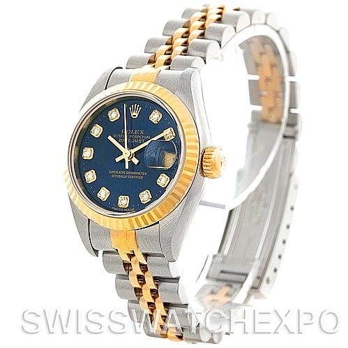 The image shows a Rolex Datejust 79173 Women's Stainless Steel Blue Dial 79173 Women's Stainless Steel Blue Dial watch at a three-quarter angle, highlighting the blue dial, gold fluted bezel, and two-tone bracelet.