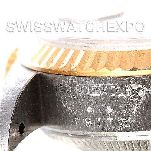 Close-up of the side case of a Rolex Datejust 79173 Women's Stainless Steel Blue Dial 79173 Women's Stainless Steel Blue Dial watch, showing the model number and part of the fluted bezel.