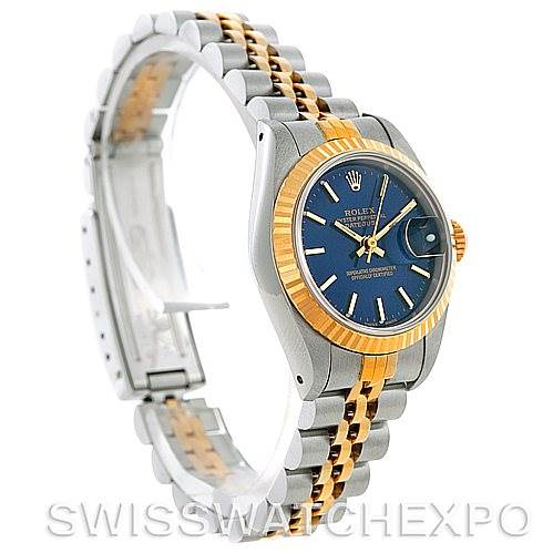 This image shows a side-angle view of a Rolex Datejust 69173 Women's Stainless Steel Blue Dial 69173 Women's Stainless Steel Blue Dial watch, highlighting its blue dial, two-tone bracelet, and fluted bezel.