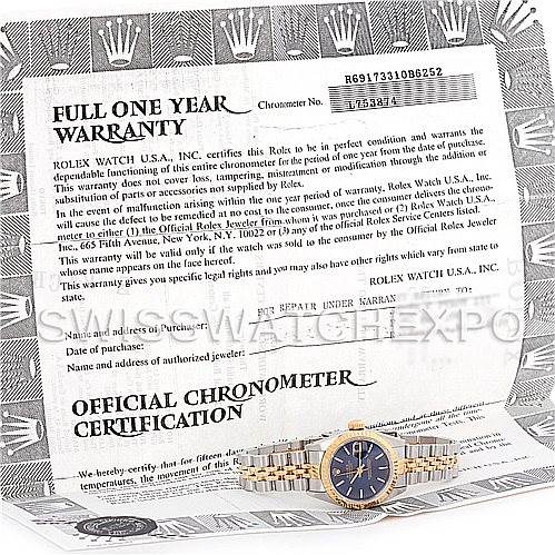 This image shows a Rolex Datejust 69173 Women's Stainless Steel Blue Dial 69173 Women's Stainless Steel Blue Dial watch placed on an official chronometer certification and warranty document.