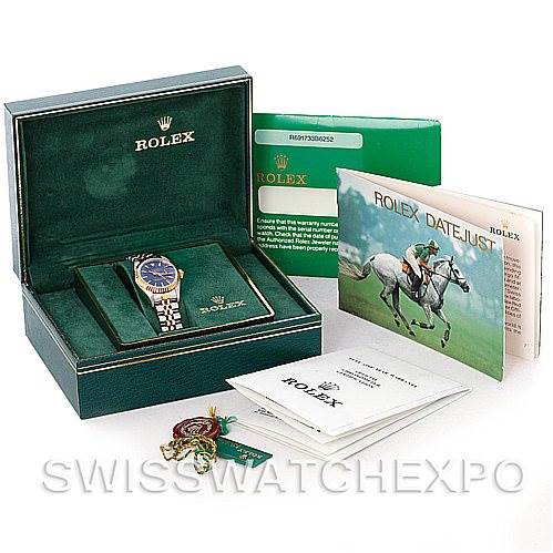 This image shows a Rolex Datejust 69173 Women's Stainless Steel Blue Dial 69173 Women's Stainless Steel Blue Dial watch with its box, warranty card, tags, and manuals.