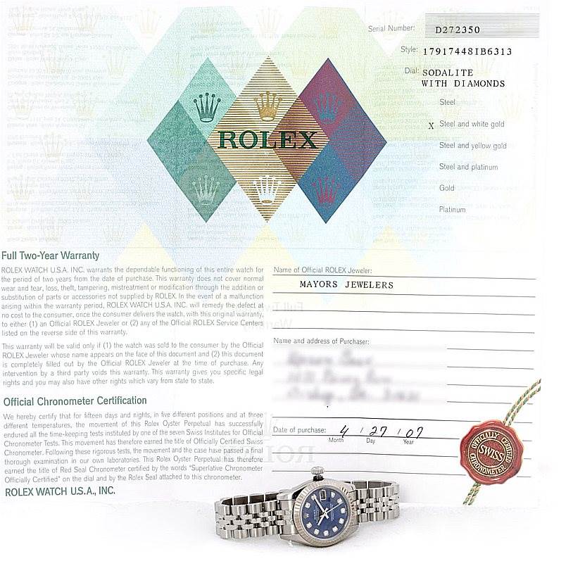 The image shows a front-facing Rolex Datejust 179174 Women's Stainless Steel Blue Dial 179174 Women's Stainless Steel Blue Dial watch and its warranty certificate.