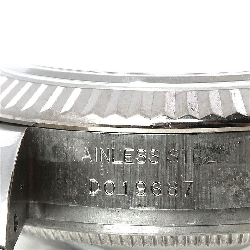 This image shows a close-up view of the stainless steel casing and serial number of the Rolex Datejust 179174 Women's Stainless Steel Blue Dial 179174 Women's Stainless Steel Blue Dial.