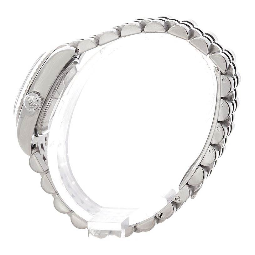 The image shows a side view of a Rolex Datejust 179174 Women's Stainless Steel Blue Dial 179174 Women's Stainless Steel Blue Dial watch highlighting the crown, case, and metal bracelet.