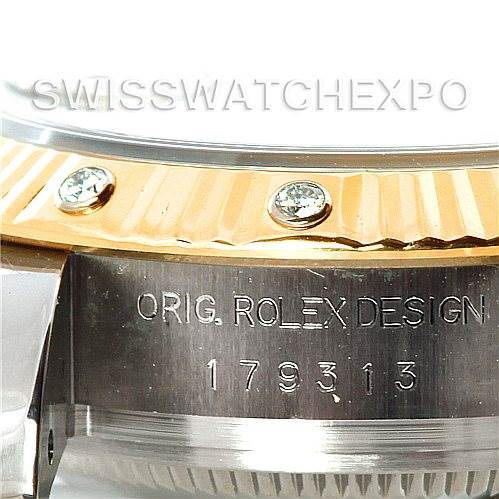 The image shows a close-up side view of a Rolex Datejust 179313 Women's Stainless Steel Mother of Pearl Dial 179313 Women's Stainless Steel Mother of Pearl Dial watch model 179313, highlighting the bezel and engraving on the case.