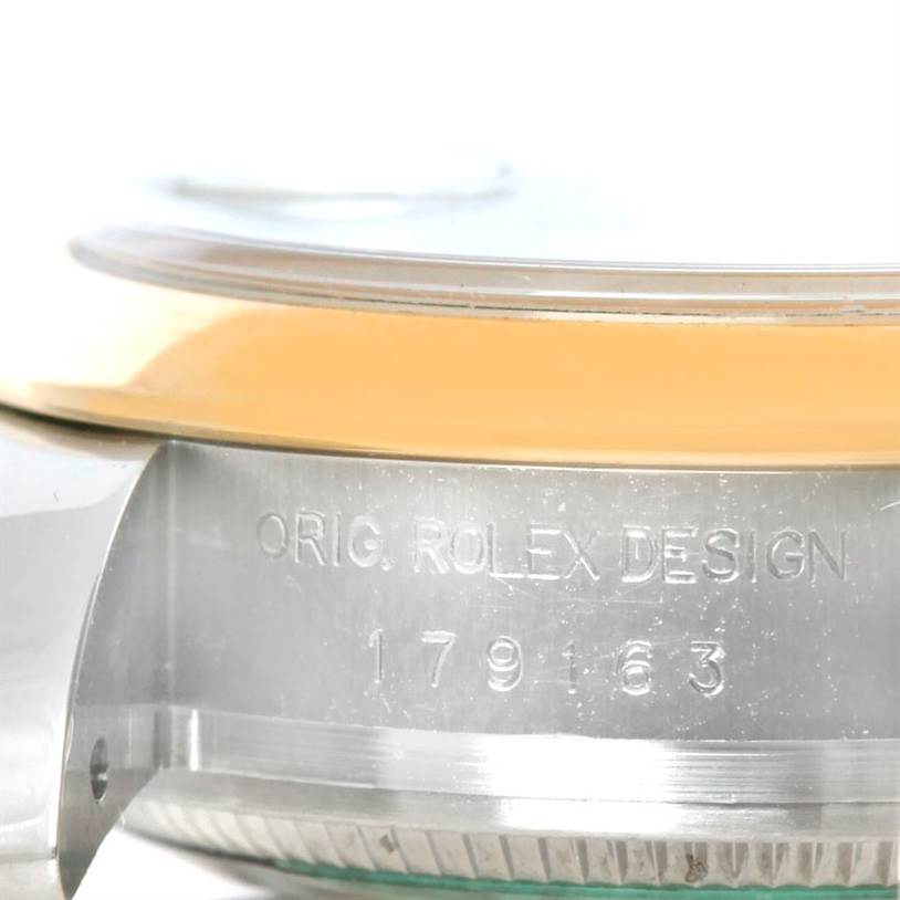 The image shows a close-up side view of the case edge of a Rolex Datejust 179163 Women's Steel and Gold (two tone) White Dial 179163 Women's Steel and Gold (two tone) White Dial watch, revealing the serial engraving.