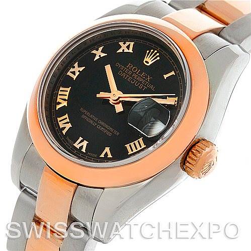 This image shows a close-up of a Rolex Datejust 179161 Women's Steel and Gold (two tone) Black Dial 179161 Women's Steel and Gold (two tone) Black Dial watch's face, crown, and part of the two-tone bracelet.