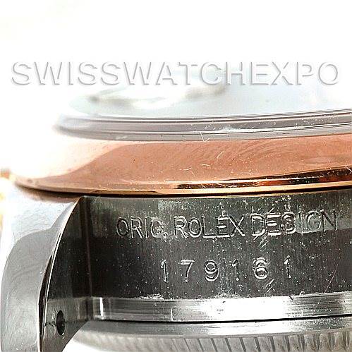 This close-up image shows the side engraving and part of the bezel of a Rolex Datejust 179161 Women's Steel and Gold (two tone) Black Dial 179161 Women's Steel and Gold (two tone) Black Dial watch.