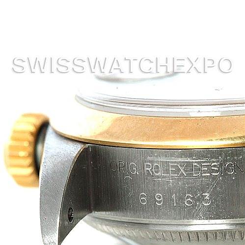 The image shows a close-up of the right side of the Rolex Datejust 69163 Women
s Stainless Steel Champagne Dial 69163 Women
s Stainless Steel Champagne Dial watch case, highlighting the crown and part of the model number engraving.