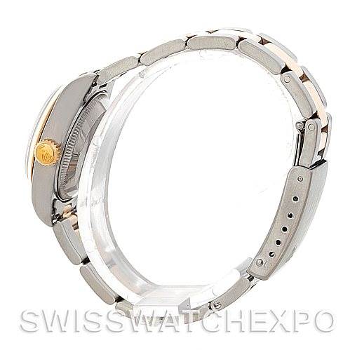 The image shows a side view of a Rolex Datejust 69163 Women
s Stainless Steel Champagne Dial 69163 Women
s Stainless Steel Champagne Dial watch, highlighting the case, crown, and bracelet.