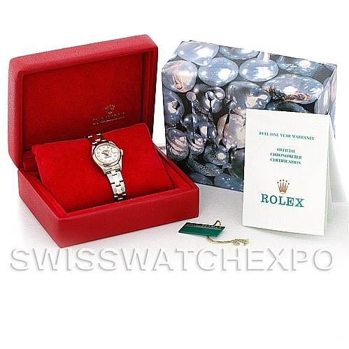 The Rolex Datejust 79163 Women's Steel and Gold (two tone) Silver Dial 79163 Women's Steel and Gold (two tone) Silver Dial watch is shown in a red box with its packaging, certification booklet, and a tag.