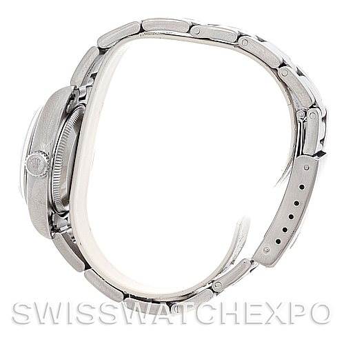 The image shows a side profile of a Rolex Datejust 79160 Women
s Stainless Steel Silver Dial 79160 Women
s Stainless Steel Silver Dial watch, highlighting its band, crown, and part of the case.