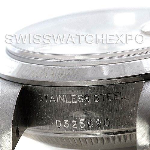 This image shows a close-up of the side case with the serial number of a Rolex Datejust 79160 Women
s Stainless Steel Silver Dial 79160 Women
s Stainless Steel Silver Dial watch, highlighting the "STAINLESS STEEL" engraving.