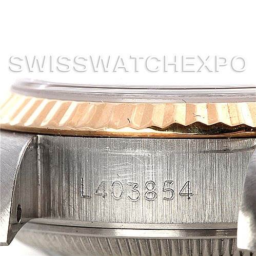 This image shows a close-up side view of the case and bezel of a Rolex Datejust 69173 Women's Stainless Steel Black Dial 69173 Women's Stainless Steel Black Dial, focusing on the serial number.