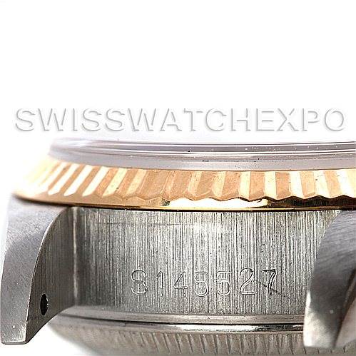 This image shows a side view of the case and bezel of a Rolex Datejust 69173 Women's Stainless Steel Champagne Dial 69173 Women's Stainless Steel Champagne Dial watch, focusing on the serial number.