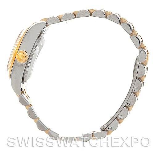This image shows the side profile of the Rolex Datejust 179173 Women's Steel and Gold (two tone) Beige Dial 179173 Women's Steel and Gold (two tone) Beige Dial watch, highlighting its two-tone bracelet and crown.