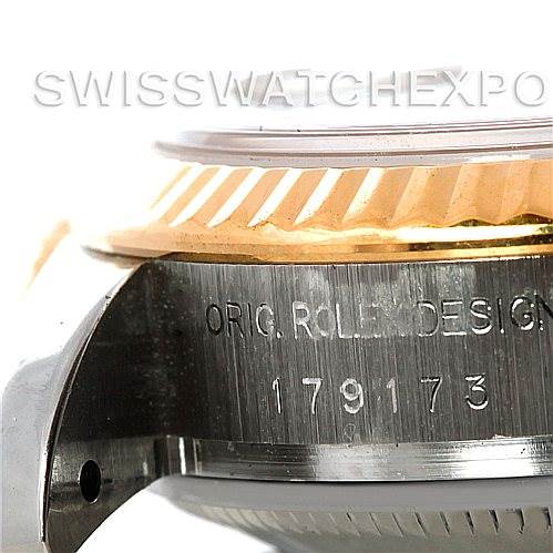 This image shows a close-up view of the side of a Rolex Datejust 179173 Women's Steel and Gold (two tone) Beige Dial 179173 Women's Steel and Gold (two tone) Beige Dial model, including the fluted bezel and model number engraving.