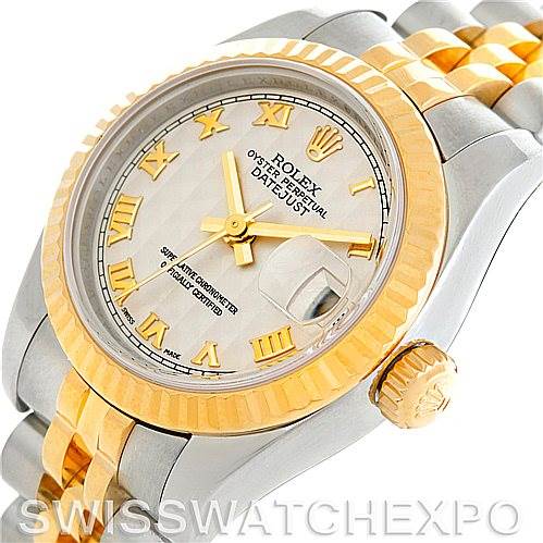 The image shows a close-up, angled view of the Rolex Datejust 179173 Women's Steel and Gold (two tone) Beige Dial 179173 Women's Steel and Gold (two tone) Beige Dial watch highlighting its dial, bezel, crown, and bracelet.