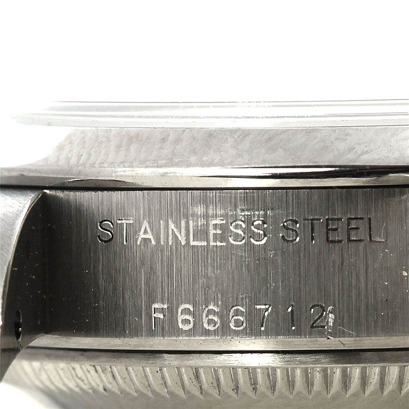 The image shows a close-up of the stainless steel case side and serial number of a Rolex Datejust 79160 Women
s Stainless Steel White Dial 79160 Women
s Stainless Steel White Dial watch.