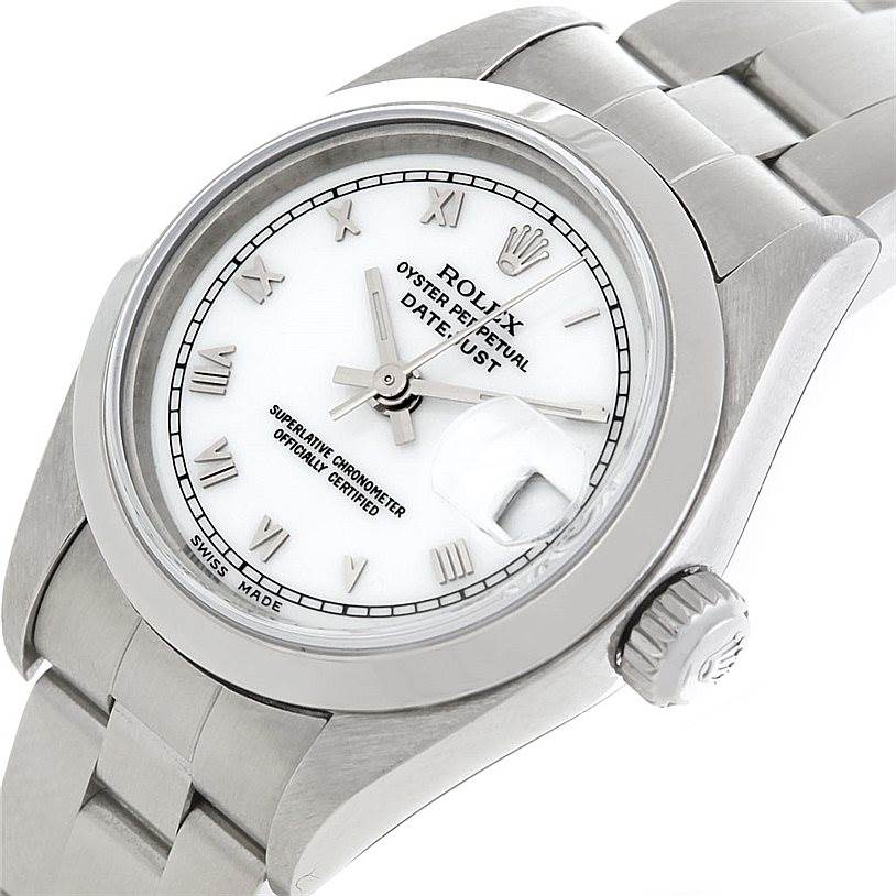 This Rolex Datejust 79160 Women
s Stainless Steel White Dial 79160 Women
s Stainless Steel White Dial watch is shown at an angle highlighting its face, crown, and part of the metal bracelet.