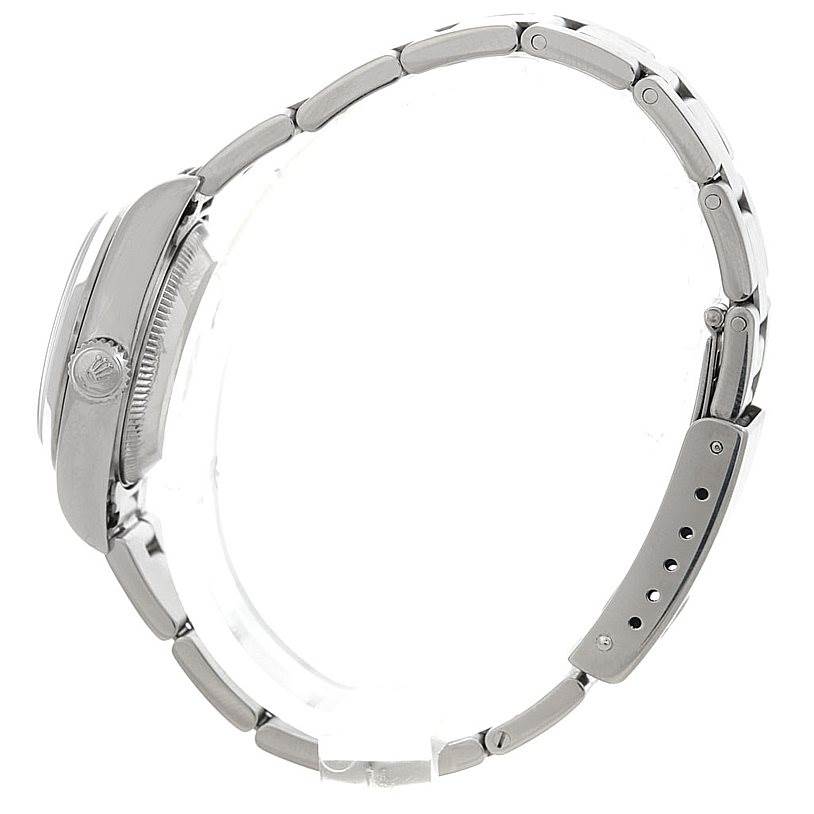 This image shows a side view of the Rolex Datejust 79160 Women
s Stainless Steel White Dial 79160 Women
s Stainless Steel White Dial watch, highlighting its crown, case, and bracelet.