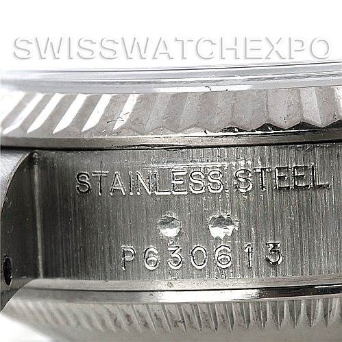 The image shows a close-up side view of a Rolex Datejust 79174 Women's Stainless Steel Blue Dial 79174 Women's Stainless Steel Blue Dial, focusing on the engraved stainless steel case back.