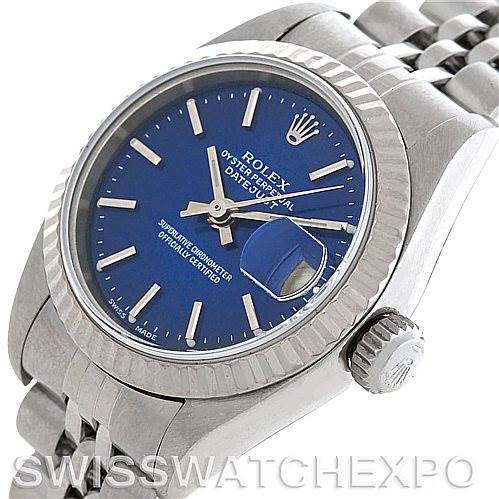 The image shows a close-up angle of the Rolex Datejust 79174 Women's Stainless Steel Blue Dial 79174 Women's Stainless Steel Blue Dial watch, highlighting the bezel, crown, blue dial, and part of the bracelet.