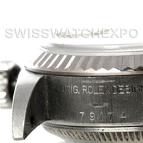 The image shows a close-up side view of a Rolex Datejust 79174 Women's Stainless Steel Mother of Pearl Dial 79174 Women's Stainless Steel Mother of Pearl Dial watch, highlighting the model number and the "ORIG. ROLEX DESIGN" engraving.