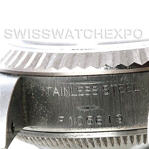 This close-up image of a Rolex Datejust 79174 Women's Stainless Steel Mother of Pearl Dial 79174 Women's Stainless Steel Mother of Pearl Dial model showcases the stainless steel casing with some serial number visible.