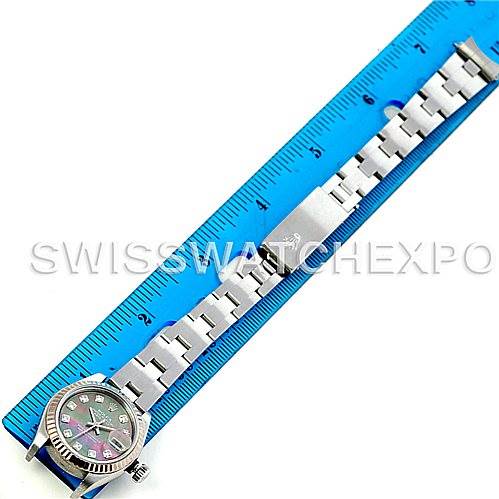 The image shows a Rolex Datejust 79174 Women's Stainless Steel Mother of Pearl Dial 79174 Women's Stainless Steel Mother of Pearl Dial watch from the top, highlighting the dial, bezel, and part of the bracelet alongside a blue ruler.