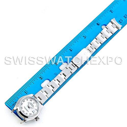 The image shows a Rolex Datejust 79160 Women's Stainless Steel White Dial 79160 Women's Stainless Steel White Dial watch laid flat next to a blue ruler, displaying its face and bracelet.