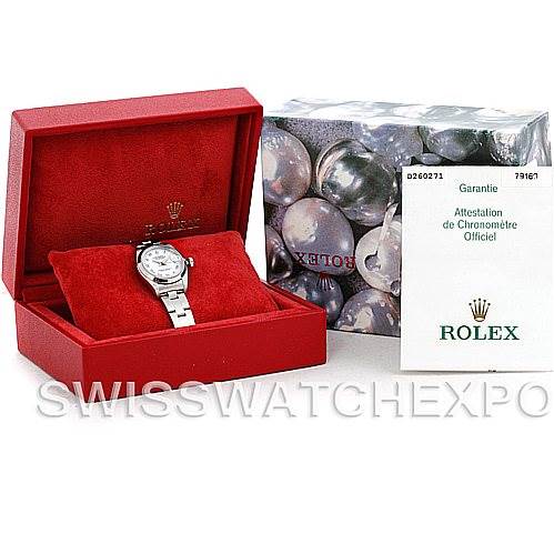 The image shows a Rolex Datejust 79160 Women's Stainless Steel White Dial 79160 Women's Stainless Steel White Dial watch in a red box, displayed on a cushion, alongside its warranty card and packaging box.