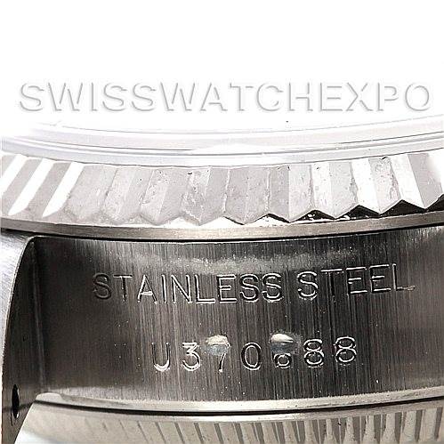 The image shows a close-up of the stainless steel side engraving and part of the bezel of a Rolex Datejust 69174 Women
s Stainless Steel Mother of Pearl Dial 69174 Women
s Stainless Steel Mother of Pearl Dial watch.