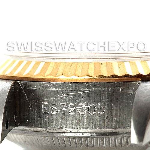 This image shows a close-up of the case side and fluted bezel of a Rolex Datejust 69173 Women's Stainless Steel Champagne Dial 69173 Women's Stainless Steel Champagne Dial watch, highlighting the serial number.