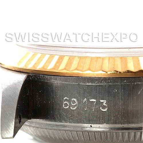 This image shows a close-up of the side of a Rolex Datejust 69173 Women's Stainless Steel Champagne Dial 69173 Women's Stainless Steel Champagne Dial watch, focusing on part of the bezel and the engraved reference number "69173."