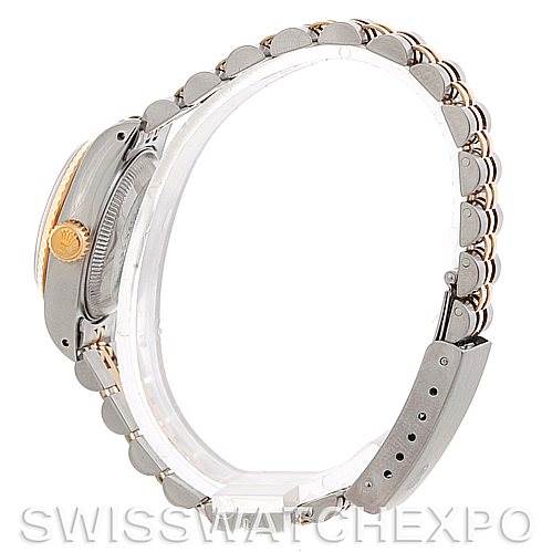 This image shows a side view of a Rolex Datejust 69173 Women's Stainless Steel Champagne Dial 69173 Women's Stainless Steel Champagne Dial watch, highlighting the crown, case, and partially visible bracelet.