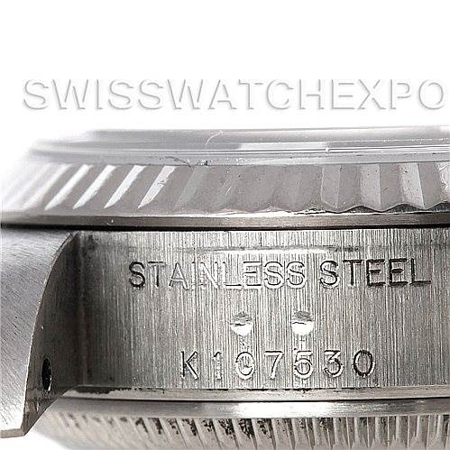 The image shows the side view of the Rolex Datejust 79174 Women's Stainless Steel Black Dial 79174 Women's Stainless Steel Black Dial's stainless steel case, highlighting the serial number engraving.