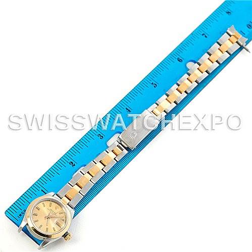 This Rolex Datejust 69163 Women's Stainless Steel Champagne Dial 69163 Women's Stainless Steel Champagne Dial watch is shown laid flat next to a ruler, displaying the face, bracelet, and clasp.