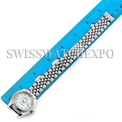 The image shows a Rolex Datejust 179174 Women's Stainless Steel Silver Dial 179174 Women's Stainless Steel Silver Dial watch laid flat next to a blue ruler, displaying the watch face and bracelet band.