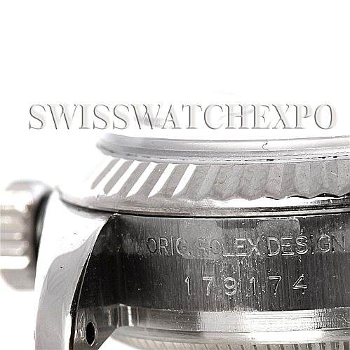 The image shows a close-up side view of a Rolex Datejust 179174 Women's Stainless Steel Silver Dial 179174 Women's Stainless Steel Silver Dial watch, focusing on the bezel and part of the crown.