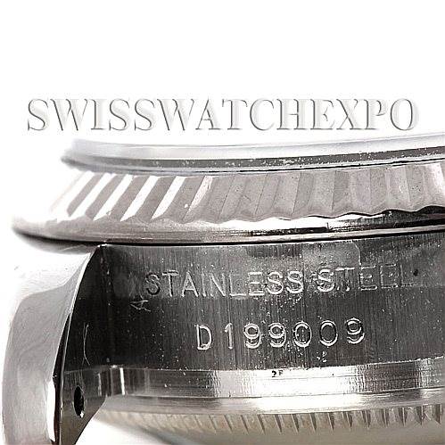 This image shows a close-up of the side and bottom case of a Rolex Datejust 179174 Women's Stainless Steel Silver Dial 179174 Women's Stainless Steel Silver Dial, highlighting the stainless steel engraving and serial number.