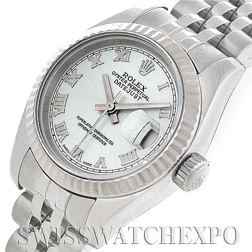 This image shows a Rolex Datejust 179174 Women's Stainless Steel Silver Dial 179174 Women's Stainless Steel Silver Dial watch from an angled top-down view, highlighting the face, bezel, crown, and part of the band.